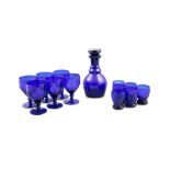 A SET OF BRISTOL BLUE GLASS TABLEWARE, comprising a set of six small water glasses and a plain