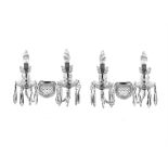 A PAIR OF WATERFORD CUT GLASS TWO BRANCH WALL SCONCES, each with scroll arm branches,