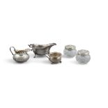 A COLLECTION OF SILVER, comprising a small repousse cream jug, Birmingham c.1893,
