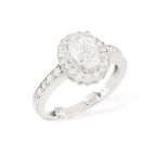 A DIAMOND SINGLE-STONE RING, the central oval-shaped diamond weight approximately 1.