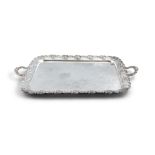 A LARGE SILVER PLATED RECTANGULAR TWO-HANDLED SERVING TRAY, the rim with cast foliate decoration