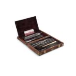 A COMPACT 19TH CENTURY MAHOGANY BRASS MOUNTED SURGEON'S CASE, containing two trays with an extensive