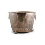 A LARGE 'ARTS AND CRAFTS' COPPER LOG BIN, of open circular form, hammered and brass studded, with