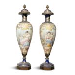 A PAIR OF LARGE SEVRES STYLE PORCELAIN VASES AND COVERS, of slender baluster form, with domed lids