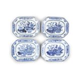 A MATCHED SET OF FOUR CHINESE BLUE AND WHITE EXPORT PLATTERS, early 19th Century, with canted