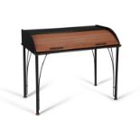 LIGNE ROSET A rolled top black lacquered desk, an enamelled metal base. 65 x 111 x 92cm(h)