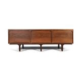 GIANFRANCO FRATTINI (1926 - 2004) A walnut sideboard by Gianfranco Frattini, three tambour doors