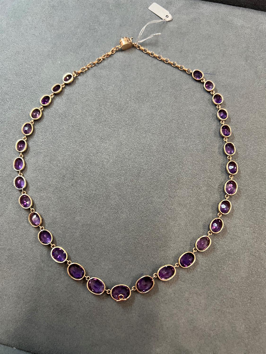 A LATE VICTORIAN AMETHYST RIVIÈRE NECKLACE, CIRCA 1900 The graduated oval-shaped amethysts, - Image 4 of 5