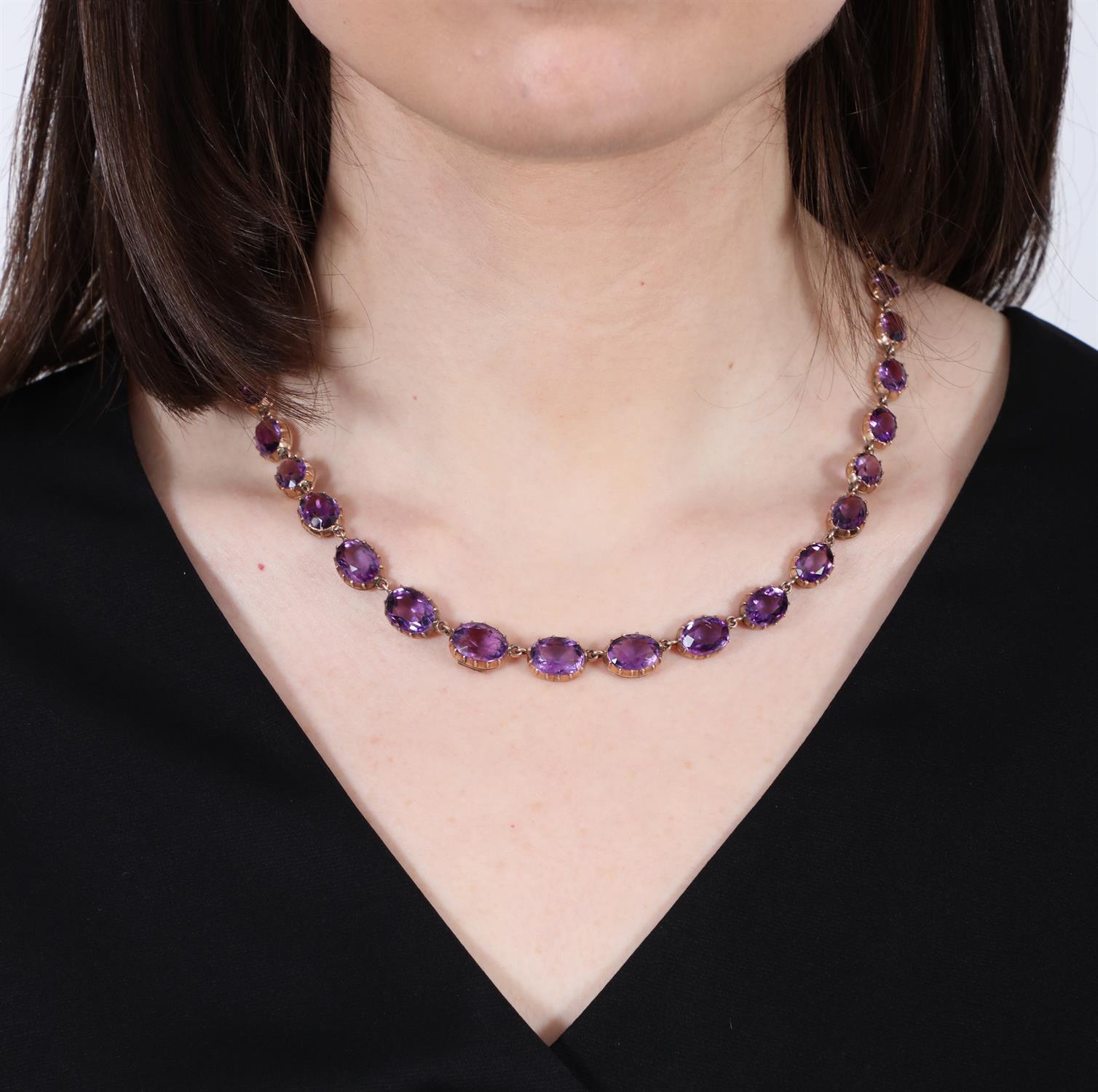 A LATE VICTORIAN AMETHYST RIVIÈRE NECKLACE, CIRCA 1900 The graduated oval-shaped amethysts, - Image 3 of 5