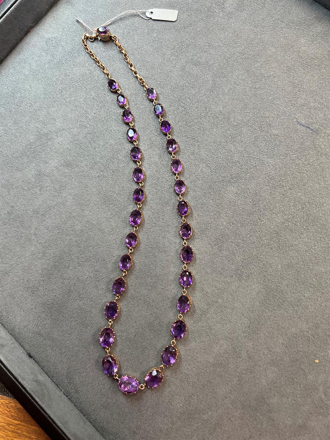 A LATE VICTORIAN AMETHYST RIVIÈRE NECKLACE, CIRCA 1900 The graduated oval-shaped amethysts, - Image 5 of 5