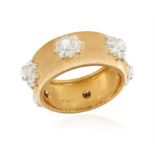 A DIAMOND DRESS RING, BY BUCCELLATI The rose lustrous 'rigato' band highlighted with six white