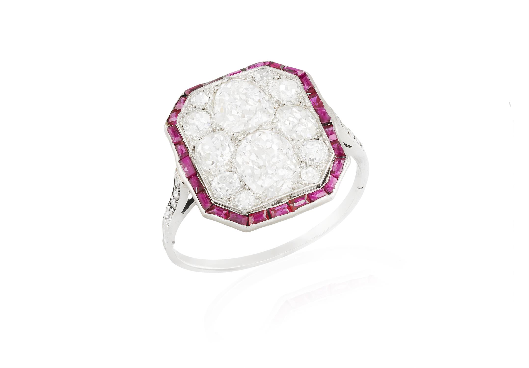 AN EARLY 20TH CENTURY DIAMOND AND RUBY DRESS RING, CIRCA 1925 The octagonal plaque centring an