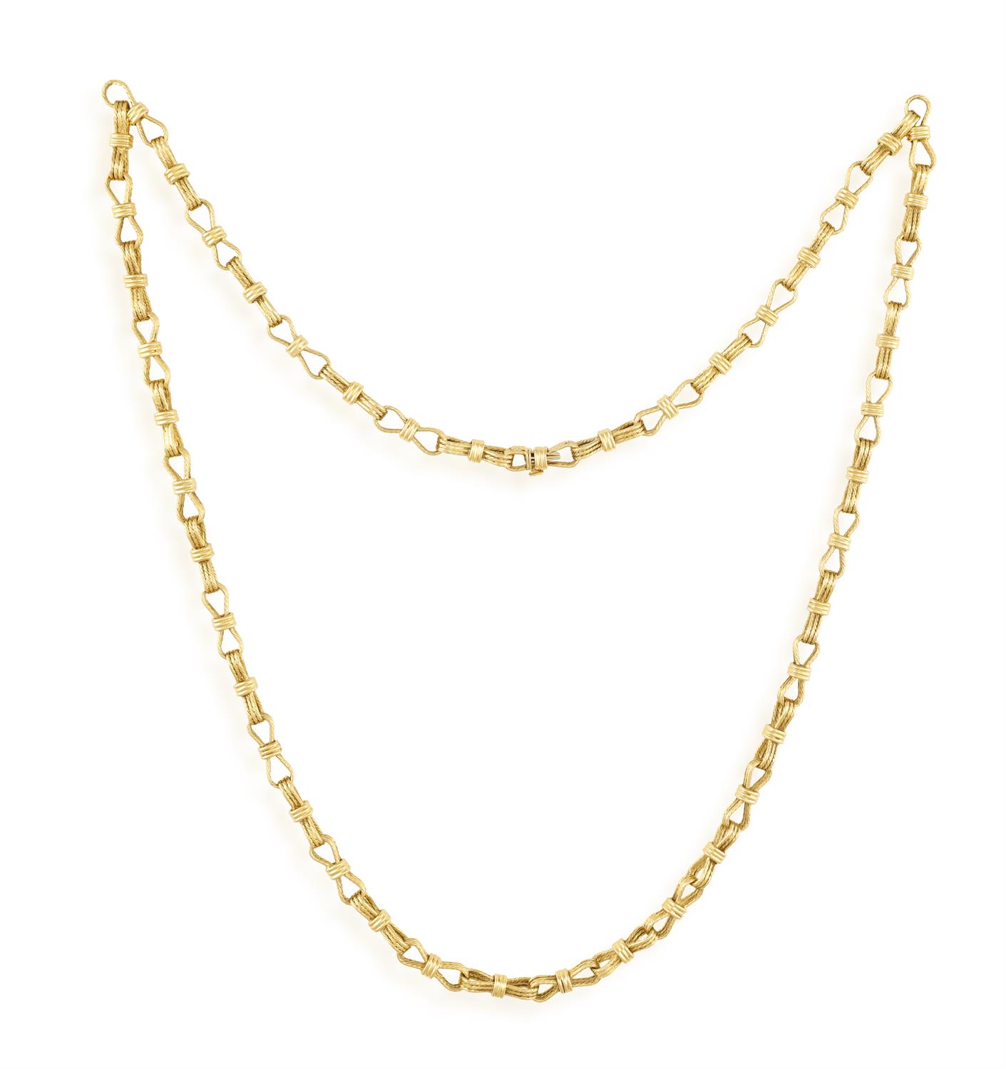 A GOLD SAUTOIR NECKLACE, BY CARLO WEINGRILL FOR BULGARI, CIRCA 1960 The long fancy-link chain