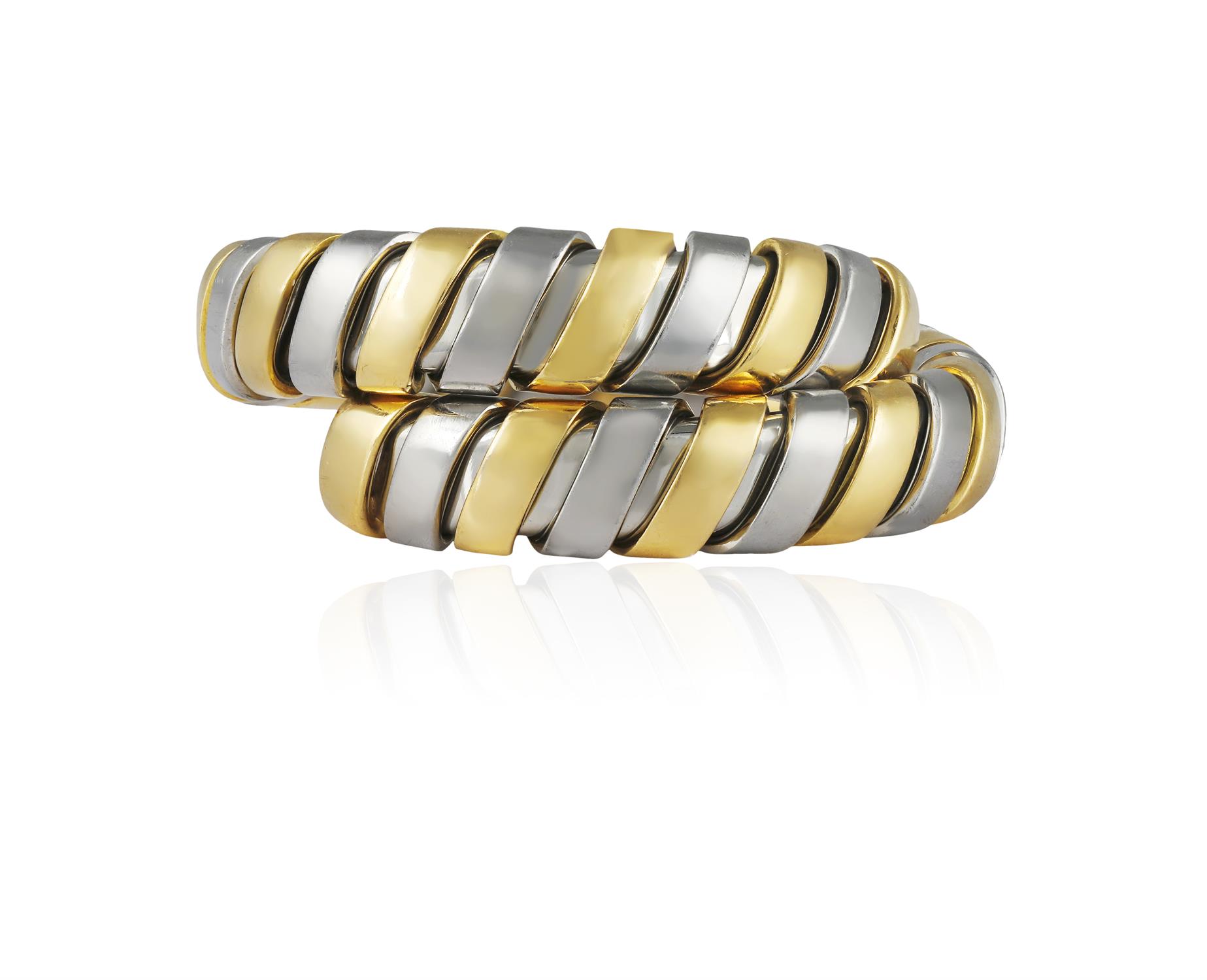A GOLD AND STEEL TUBOGAS RING, BY BULGARI Of flexible bi-coloured coil design, - Image 2 of 5