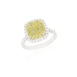 A DIAMOND SINGLE-STONE RING The cushion-shaped diamond of yellow tint weighing 5.