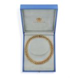 A GOLD NECKLACE, BY GARRARD, CIRCA 1990 Designed as a continuous series of interlocking gold