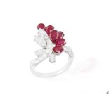 From the private collection of a continental lady A RUBY AND DIAMOND DRESS RING Of floral