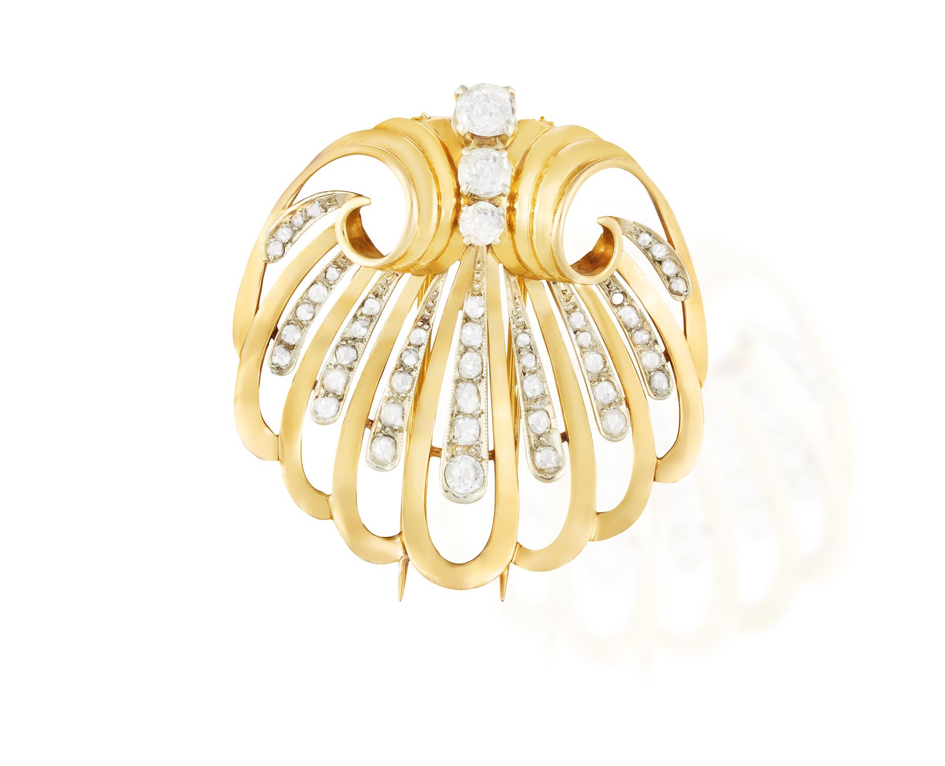 A RETRO DIAMOND BROOCH, FRENCH, CIRCA 1945 Modelled as an openwork shell with fluted scrolling