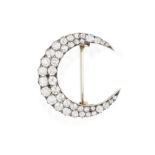 A LATE 19TH CENTURY DIAMOND BROOCH, CIRCA 1880 Of crescent design, set with old brilliant and