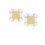 A PAIR OF COLOURED DIAMOND AND DIAMOND EARSTUDS Each cushion-shaped diamond of yellow tint