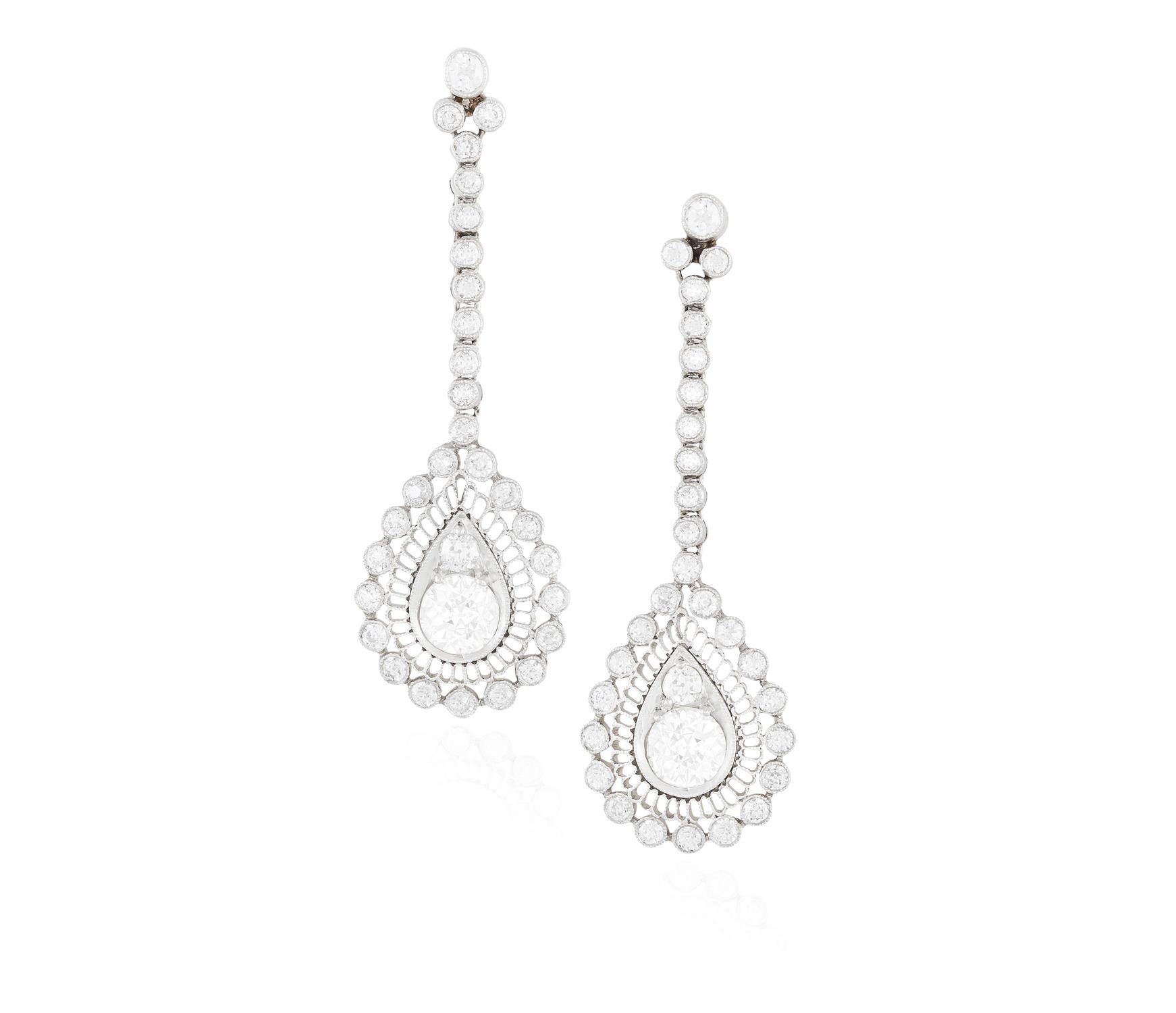 A PAIR OF DIAMOND PENDENT EARRINGS, CIRCA 1910 Each central European-cut diamonds,