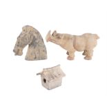 A CHINESE TANG STYLE POTTERY RHINOCEROUS, 28cm long; together with a tang style pottery horse head,