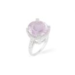 A KUNZITE AND DIAMOND COCKTAIL RING, the circular mixed-cut kunzite weighing approximately 10.