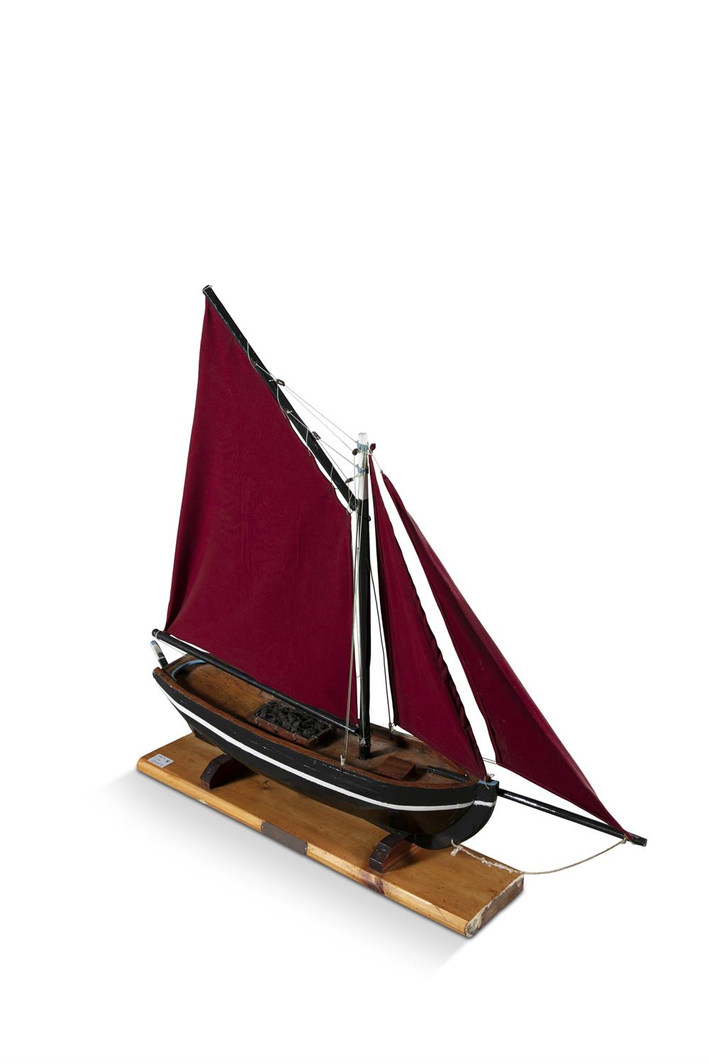 A PAINTED TIMBER MODEL OF A GALWAY HOOKER, with traditional red sails, on a timber stand. - Image 2 of 2