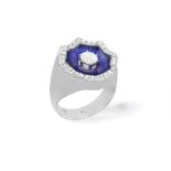 AN ENAMEL AND DIAMOND DRESS RING, the central brilliant-cut diamond within a blue enamel and