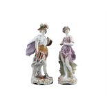 A PAIR OF CHELSEA STYLE PORCELAIN FIGURES, of a classical male and female, he carrying a sword and