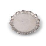 A GEORGE II SILVER ARMORIAL SALVER, London c.1750, makers mark of John Tuite, of shaped circular