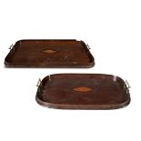 TWO EDWARDIAN INLAID MAHOGANY SERVING TRAYS, one oval form, the other of shaped rectangular form,