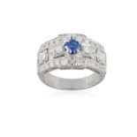 A SAPPHIRE AND DIAMOND DRESS RING, of openwork geometric design, centrally set with a