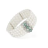 A CULTURED PEARL, DIAMOND AND EMERALD BRACELET, CIRCA 1960, composed of four rows of cultured pearl,