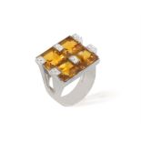 A CITRINE AND DIAMOND COCKTAIL RING BY LEGNAZZI, composed of four square-shaped citrines between