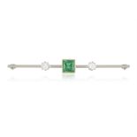 AN EMERALD AND DIAMOND BAR BROOCH, centrally-set with a square-cut emerald, between two old