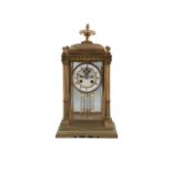 A BRASS FRAMED FOUR GLASS MANTLE CLOCK, with mercury pendulum and circular white enamel dial