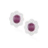 A PAIR OF RUBY AND DIAMOND EARRINGS, each central carved ruby within a scalloped surround pavé-set
