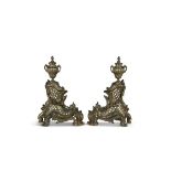 A PAIR OF FRENCH GILT BRONZE CHENETS, 19th century, each surmounted with lidded urns over rococo