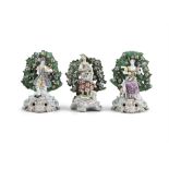 A CHELSEA PORCELAIN BROCADE GROUP, modelled as a lady with a lap of flowers and a lamb by her feet,