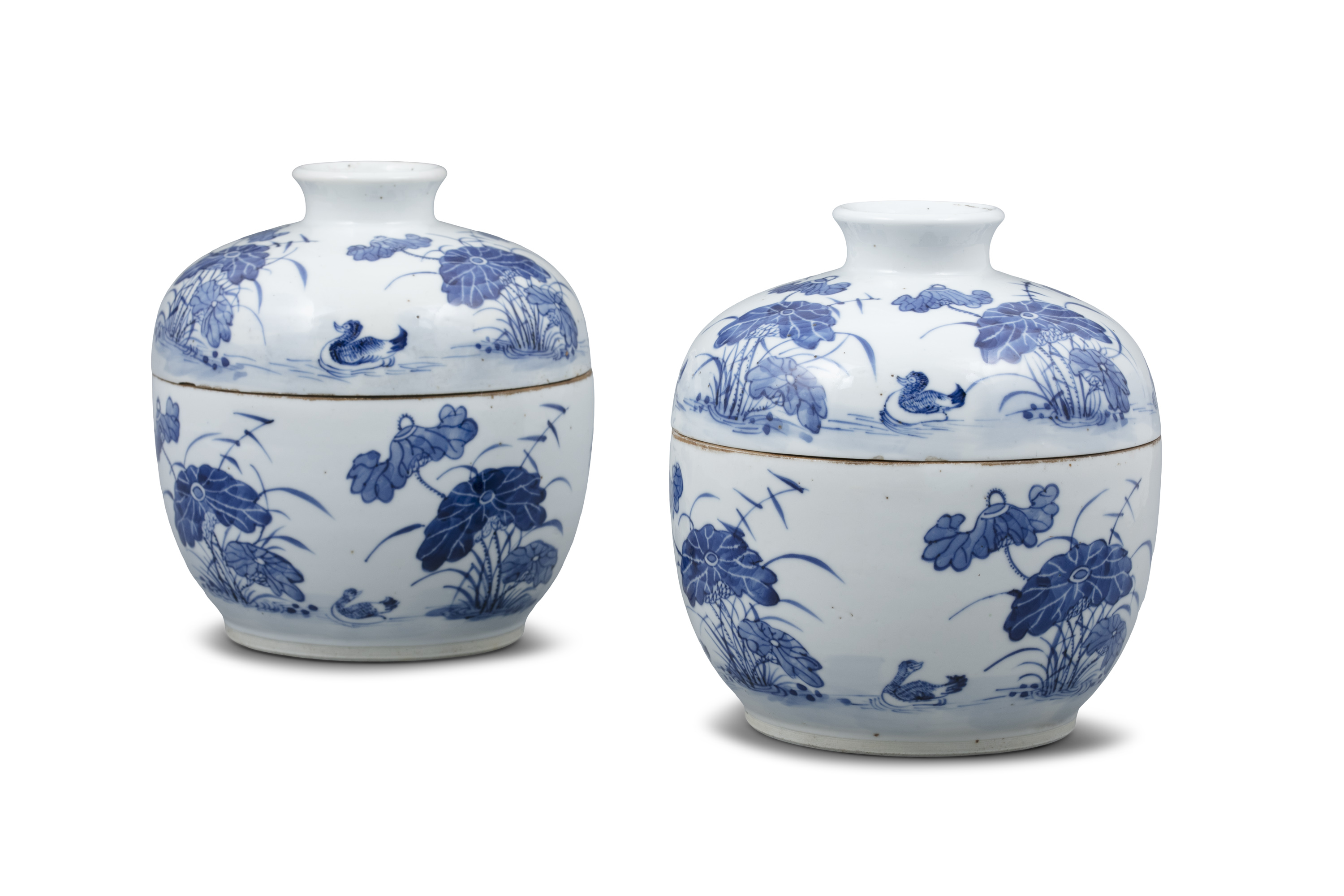 A PAIR OF BLEU DE HUE ‘MANDARIN DUCKS AND LOTUS POND’ PORCELAIN LIDDED POTS VIETNAM, POSSIBLY LATE