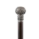 A SILVER HILTED ‘DRAGON’ WALK STICK VIETNAM, CIRCA 1900-1920 With a fluted wooden stick and a hilt