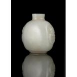 A JADE SNUFF BOTTLE CHINA, LATE QING DYNASTY Resting on a short ring foot, with a flattened egg-