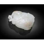 PROPERTY FROM THE F.G. COLLECTION OF JADE CARVINGS A RARE AND IMPORTANT WHITE JADE ‘MELON AND