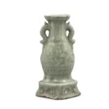A LONGQUAN CELADON TWO HANDLED MOLDED STONEWARE VASE China, Possibly Yuan to Ming Dynasty Of