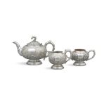 A THREE-PIECE CHINESE EXPORT SILVER ‘BAMBOO’ TEA SET BY TUCK CHANG OF SHANGHAI CHINA, LATE QING