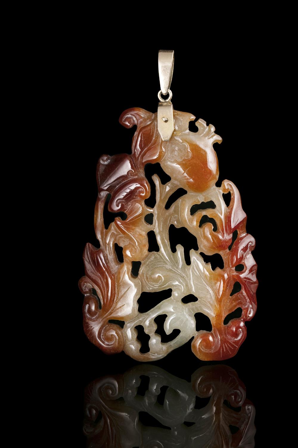 A RETICULATED RED AND GREEN JADEITE JADE ‘BATS, POMEGRANATE AND LINGZHI’ PLAQUE / PENDANT CHINA,