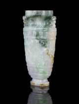 AN APPLE GREEN ACCENT MILKY JADEITE JADE ‘TAOTIE MASKS’ VASE OF ARCHAISTIC SHAPE CHINA, LATE QING