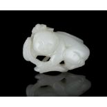 PROPERTIES FROM A FRENCH COLLECTOR OF JADE CARVINGS AND SNUFFBOTTLES A WHITE JADE CARVING OF A