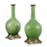 AN ORMOLU MOUNTED PAIR OF APPLE GREEN PORCELAIN VASES THE PORCELAINS: CHINA, QING DYNASTY THE